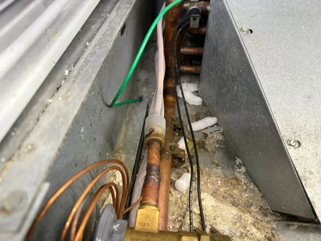 Corroded refrigerant lines, a common fault found in walk-in coolers and freezers